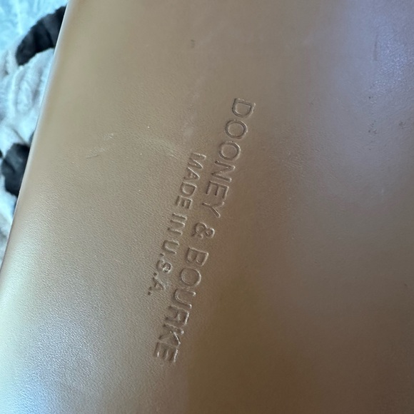 vintage Dooney & Bourke Cabriolet perforated leather backpack.